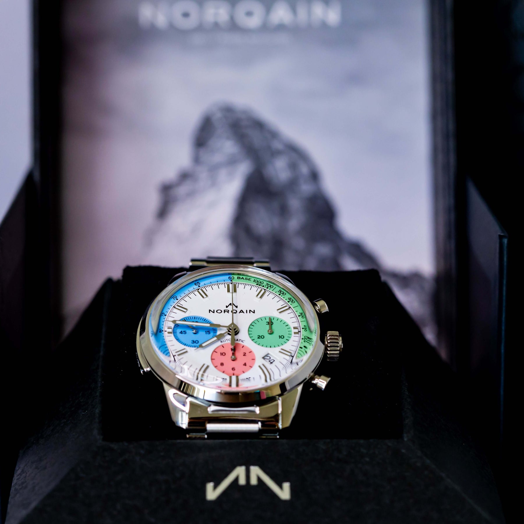Norqain Freedom 60 Chrono Ice Cream Limited Edition watch displayed in an elegant box, showcasing its unique color palette.