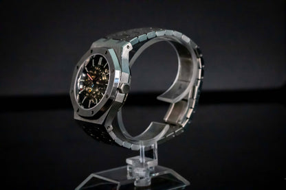 Angled shot of Seiko Mod Oak Skeleton Silver highlighting open-heart design and brushed finish