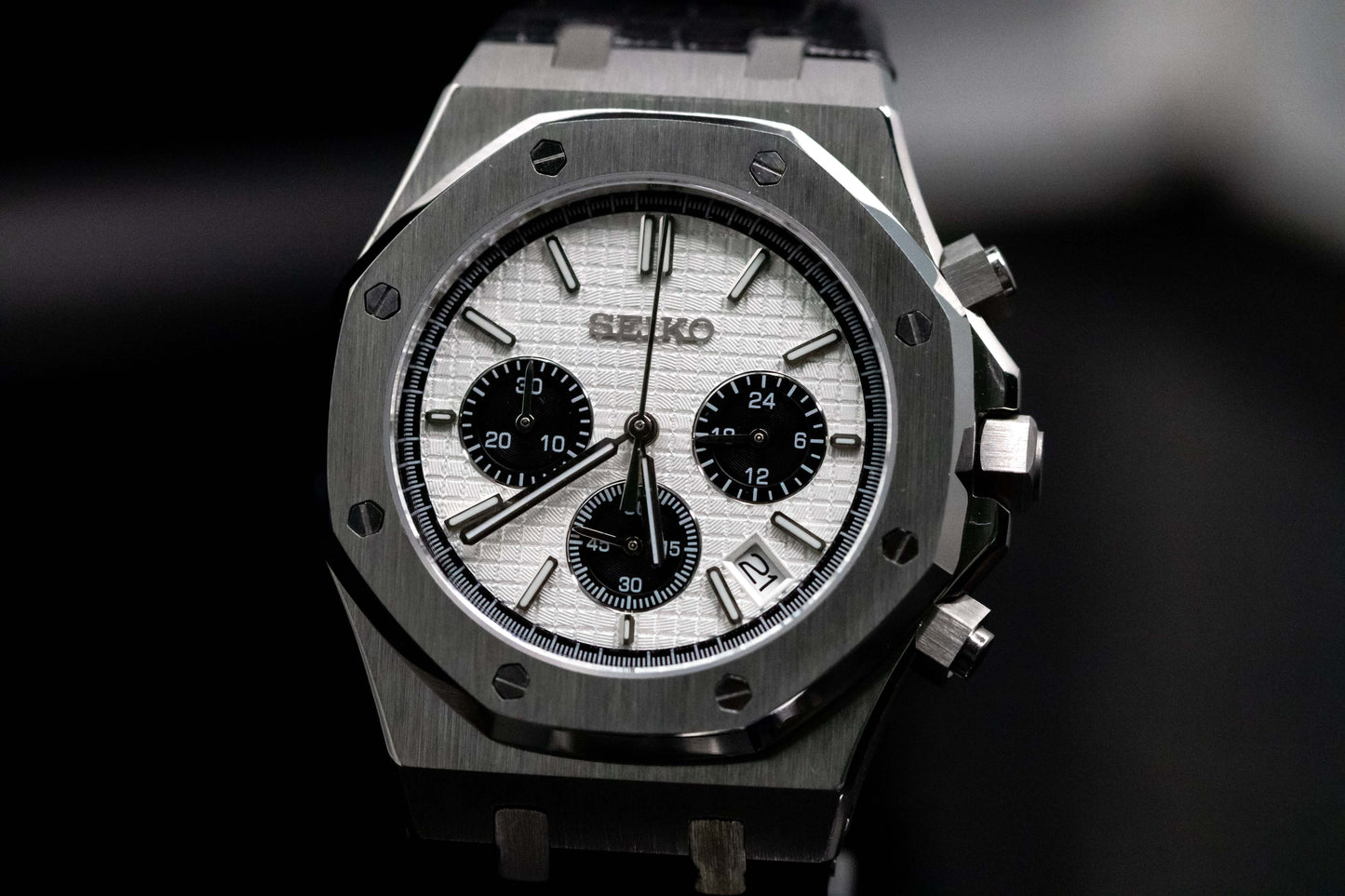 Seiko Mod Royal Oak Chronograph Panda watch with white dial and black sub-dials, showcasing a modern design and elegant craftsmanship.