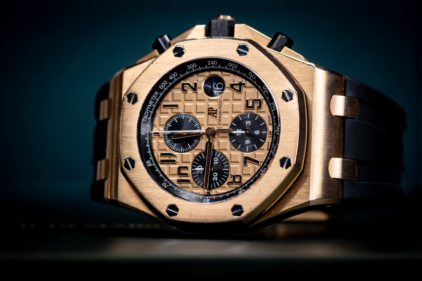 Audemars Piguet Royal Oak Offshore Chronograph 42mm in rose gold with black rubber strap, showcasing its intricate dial design.