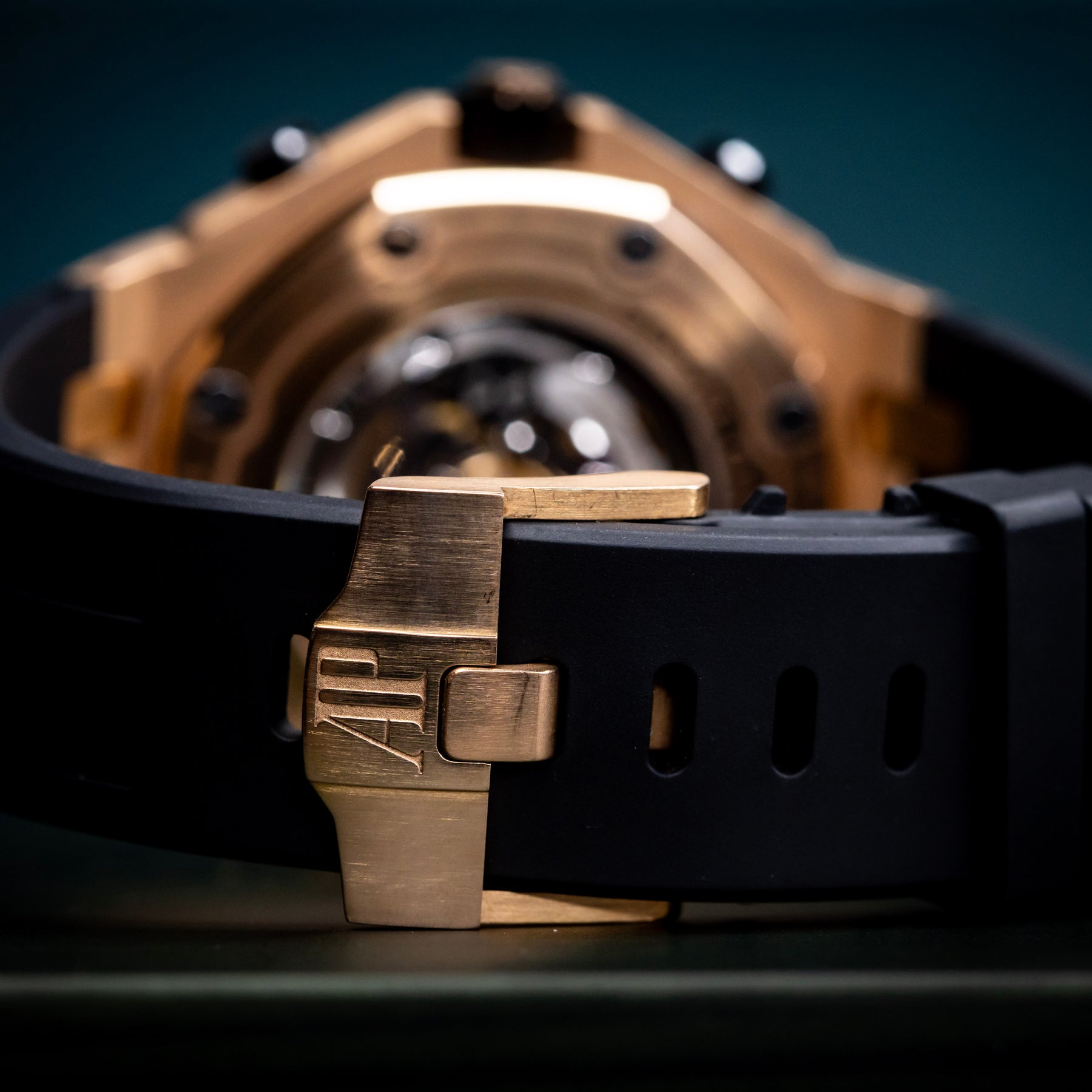 Audemars Piguet Royal Oak Offshore Chronograph 42mm rose gold watch strap with black rubber band and clasp.
