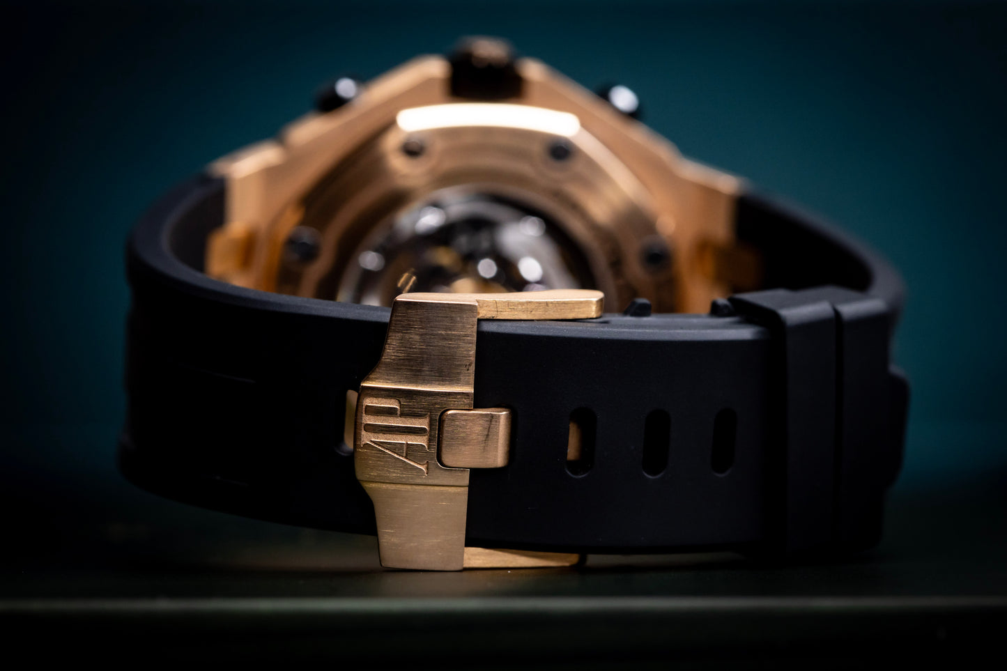 Audemars Piguet Royal Oak Offshore Chronograph 42mm rose gold watch strap with black rubber band and clasp.