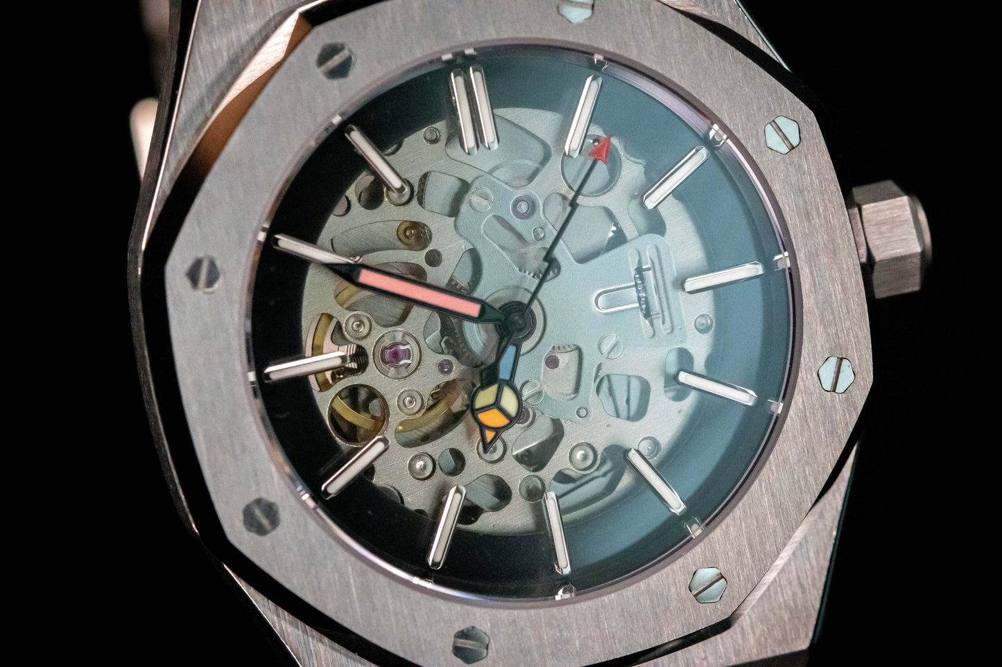 Close-up of skeleton dial on Seiko Mod Oak Silver showing mechanical movement