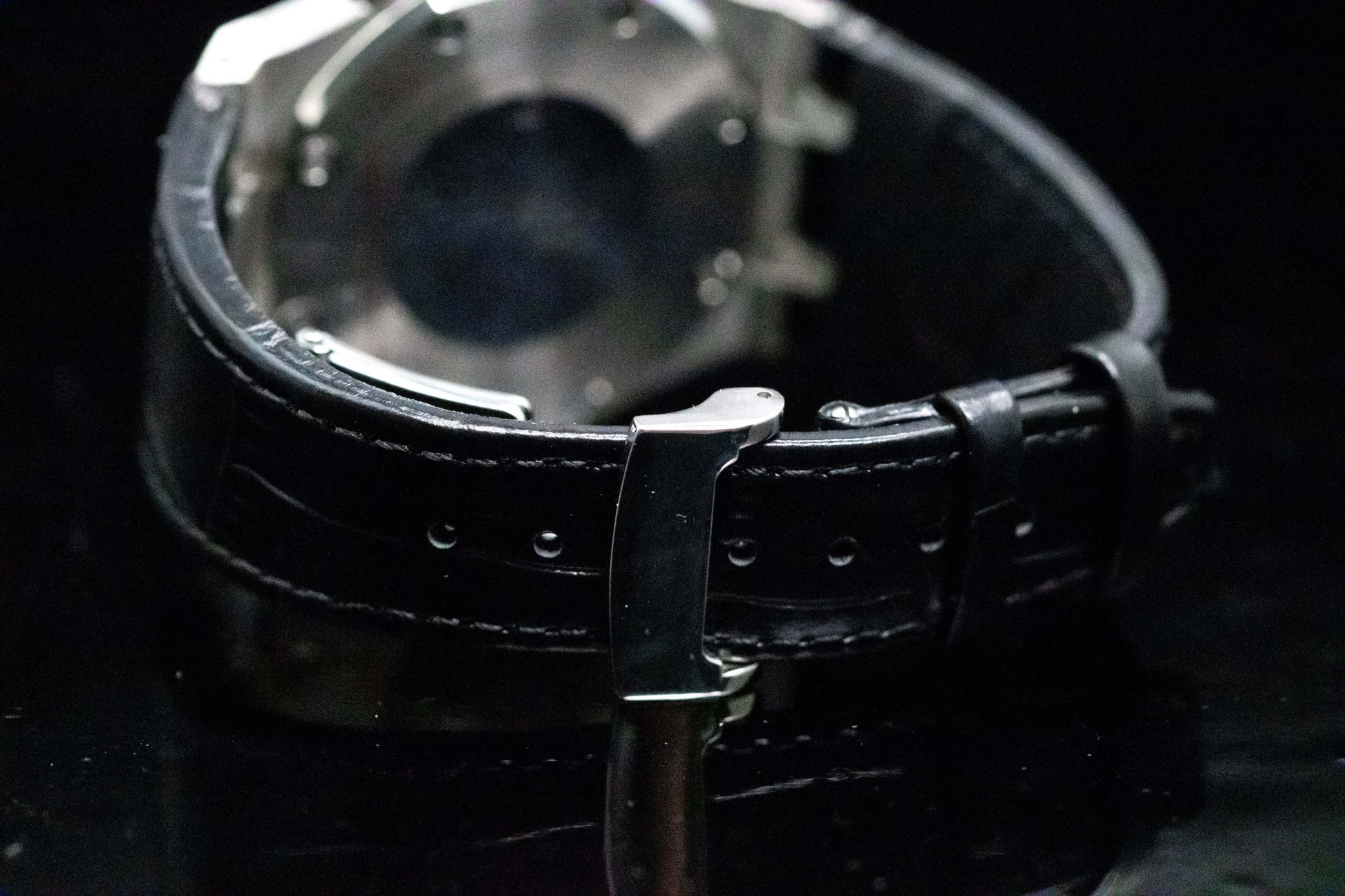 Seiko Mod Royal Oak Panda Chrono detailing on black leather strap with butterfly clasp and transparent back.