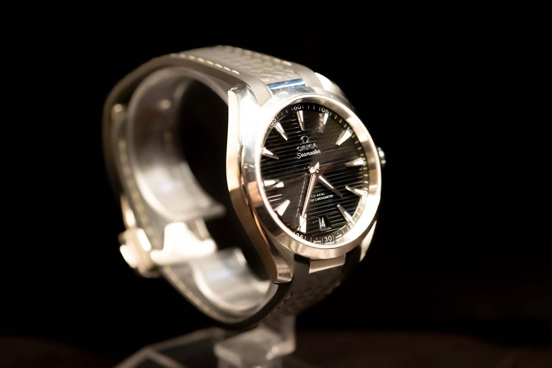 2022 Omega Seamaster Aqua Terra watch with black teak-pattern dial on display.