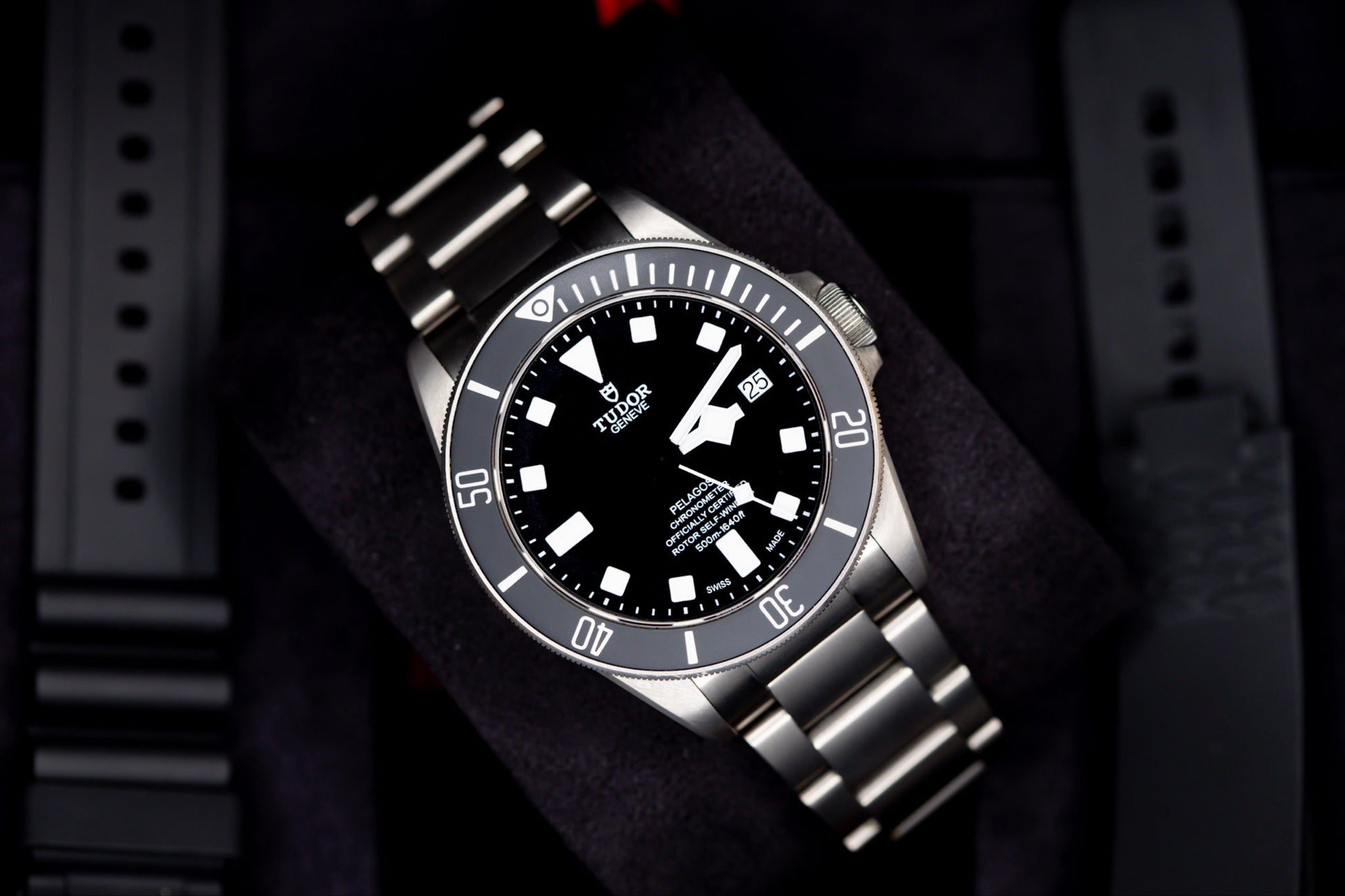 Tudor Pelagos dive watch showcasing a high-performance design with a titanium bracelet and black dial, perfect for underwater adventures.