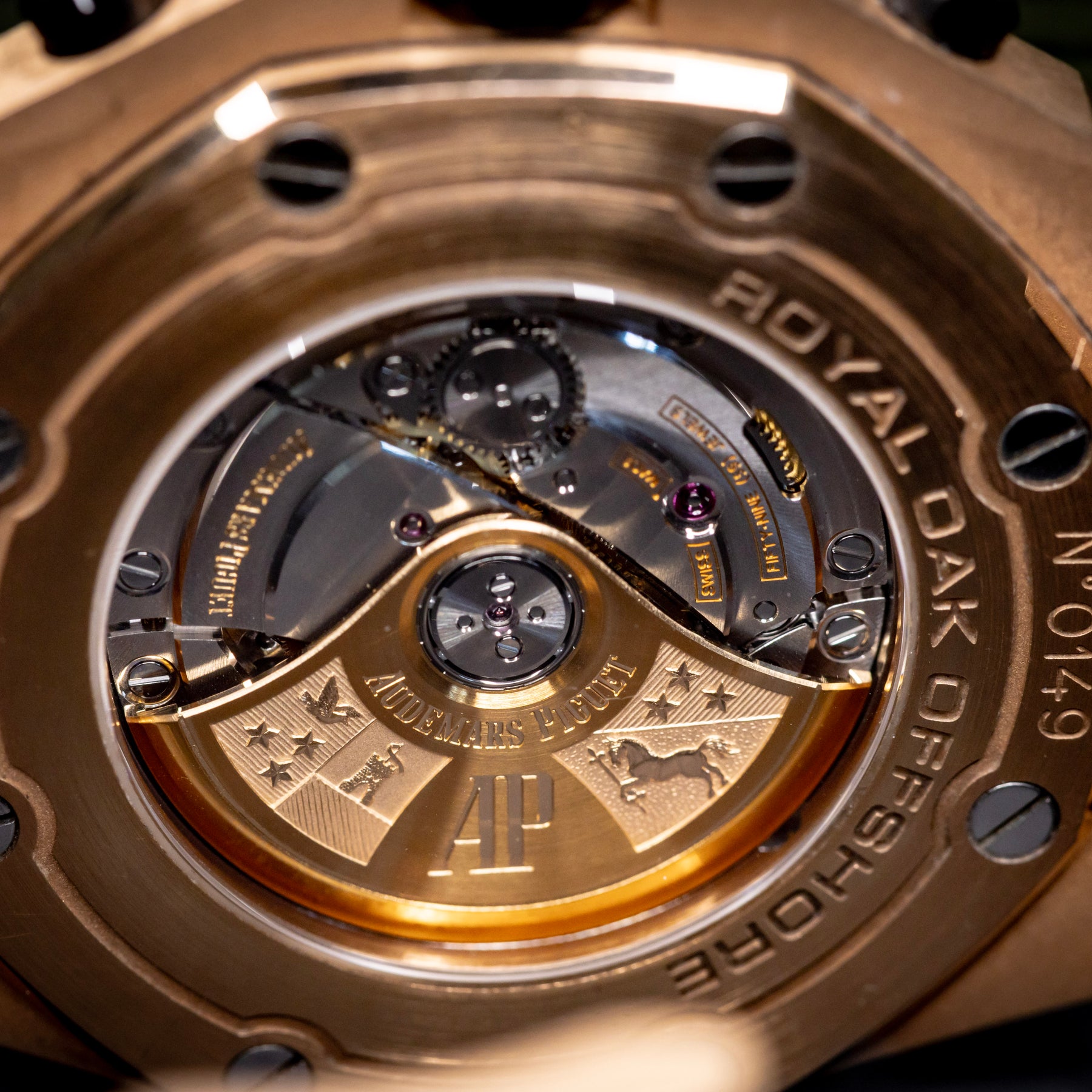 Audemars Piguet Royal Oak Offshore Chronograph 42mm rose gold watch case back view with intricate movement details.