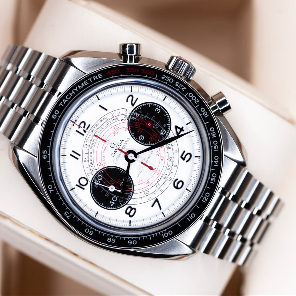 2024 Omega Speedmaster Chronoscope on wrist, featuring silvery dial and black subdials for vintage timing.