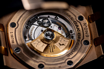 Close-up of the movement of Audemars Piguet Royal Oak Offshore Chronograph 42mm in rose gold, showcasing intricate details.