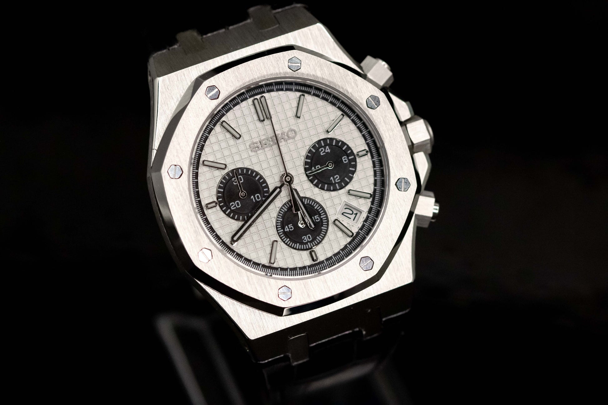 Seiko Mod Royal Oak Chronograph Panda watch with a white dial and black sub-dials, showcasing its elegant design.