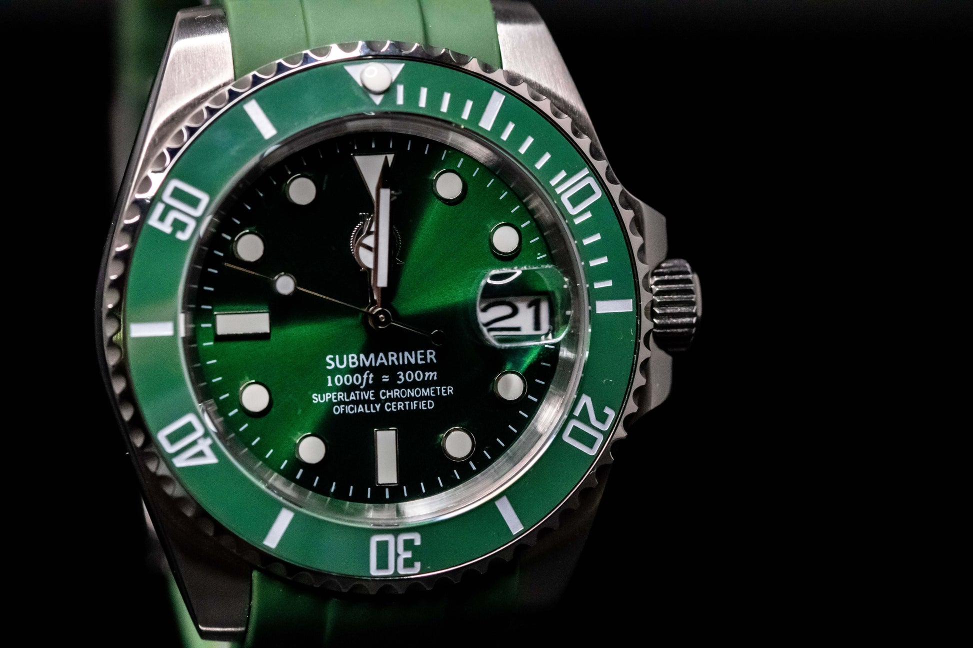 KWC Hulk Diver watch with vibrant green dial, ceramic bezel, and stainless steel case on a green rubber strap.