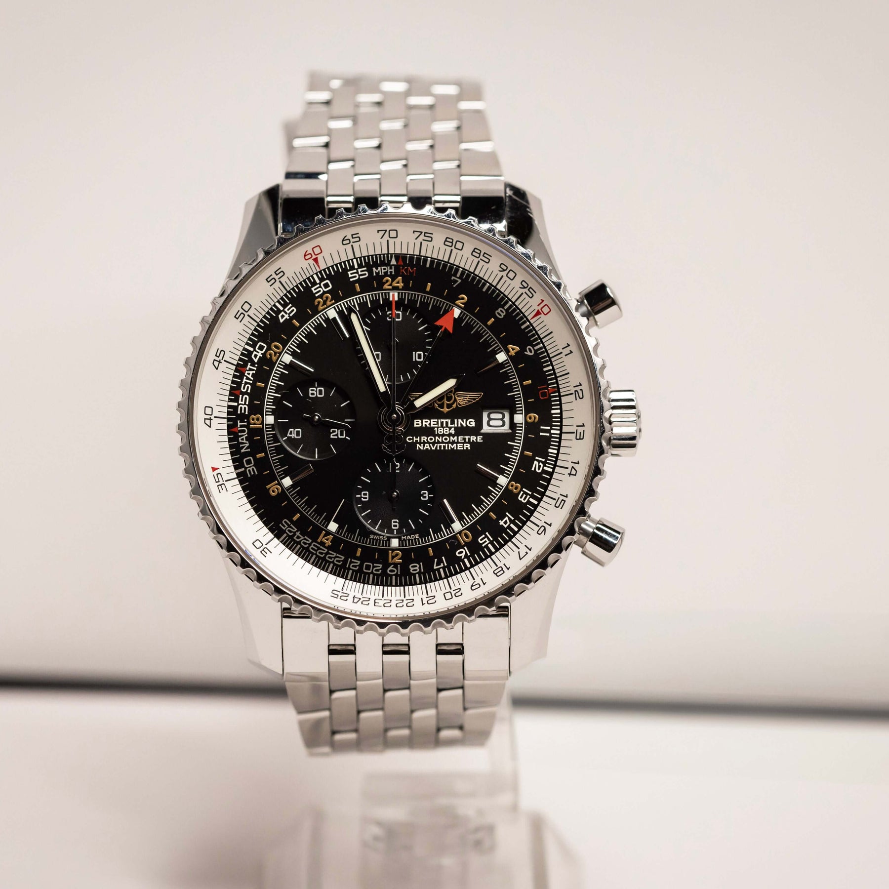 Breitling Navitimer World Chronograph GMT 46 mm with black dial and stainless steel bracelet on display.