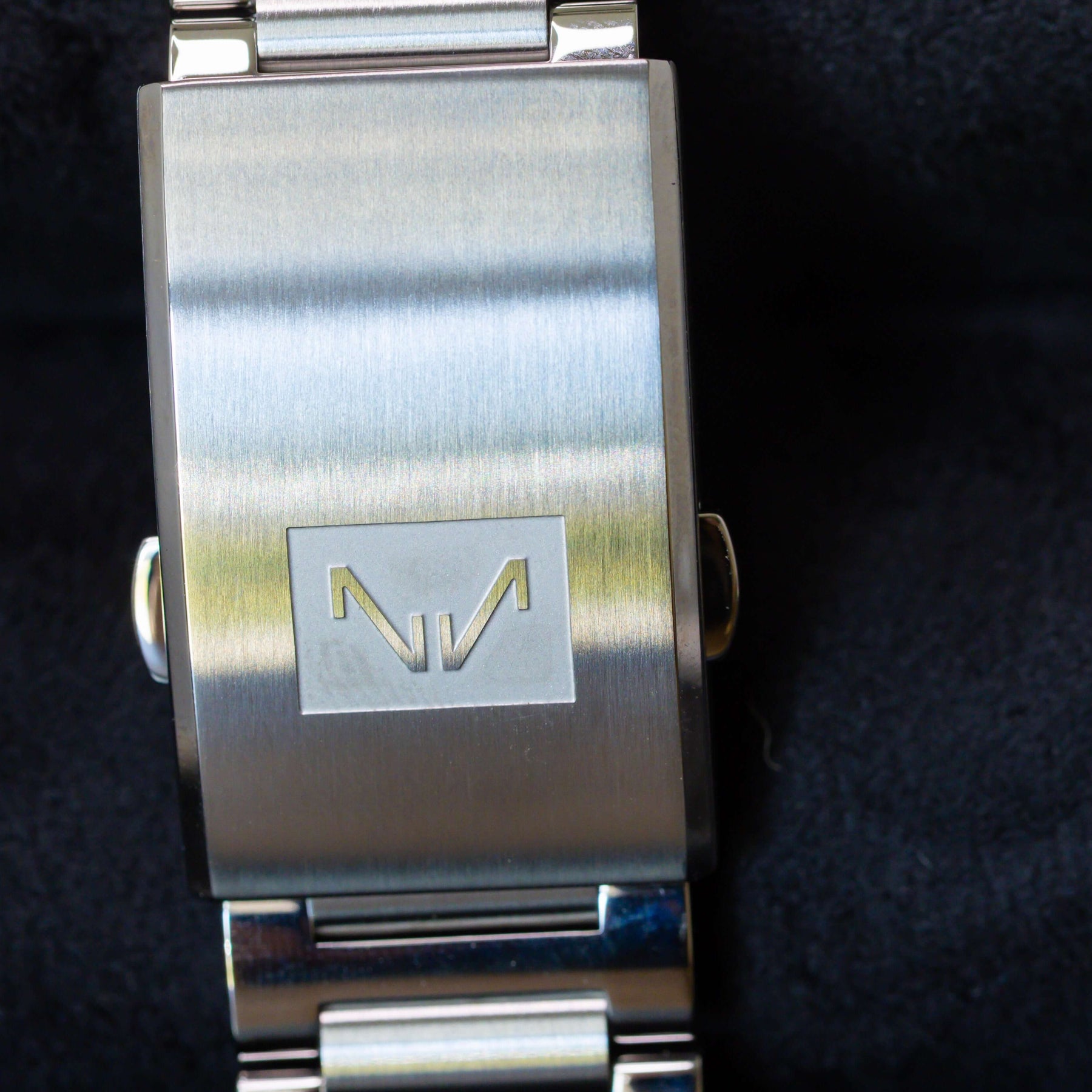 Norqain Freedom 60 Chrono Ice Cream Limited Edition watch back view with engraved logo, showcased on black velvet.