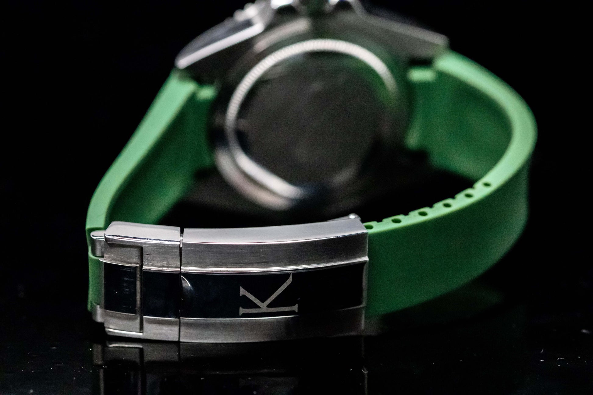KWC Hulk Diver watch with green rubber strap and stainless steel clasp, showcasing luxury craftsmanship.