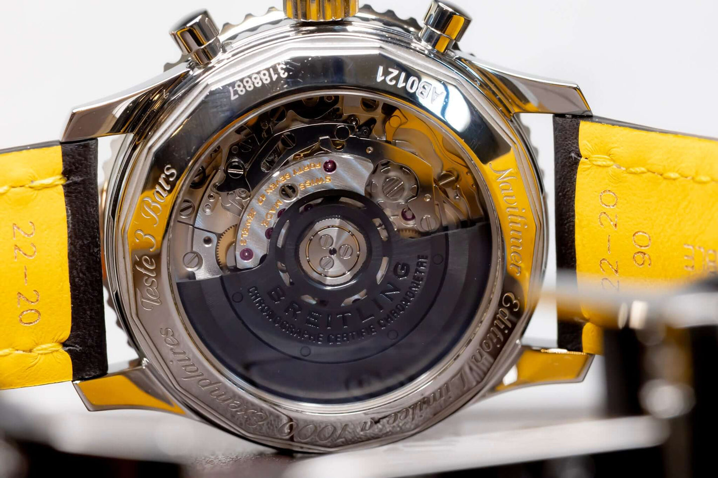 Breitling Navitimer 01 Stratus Gray limited edition watch case back with yellow strap and intricate movement details