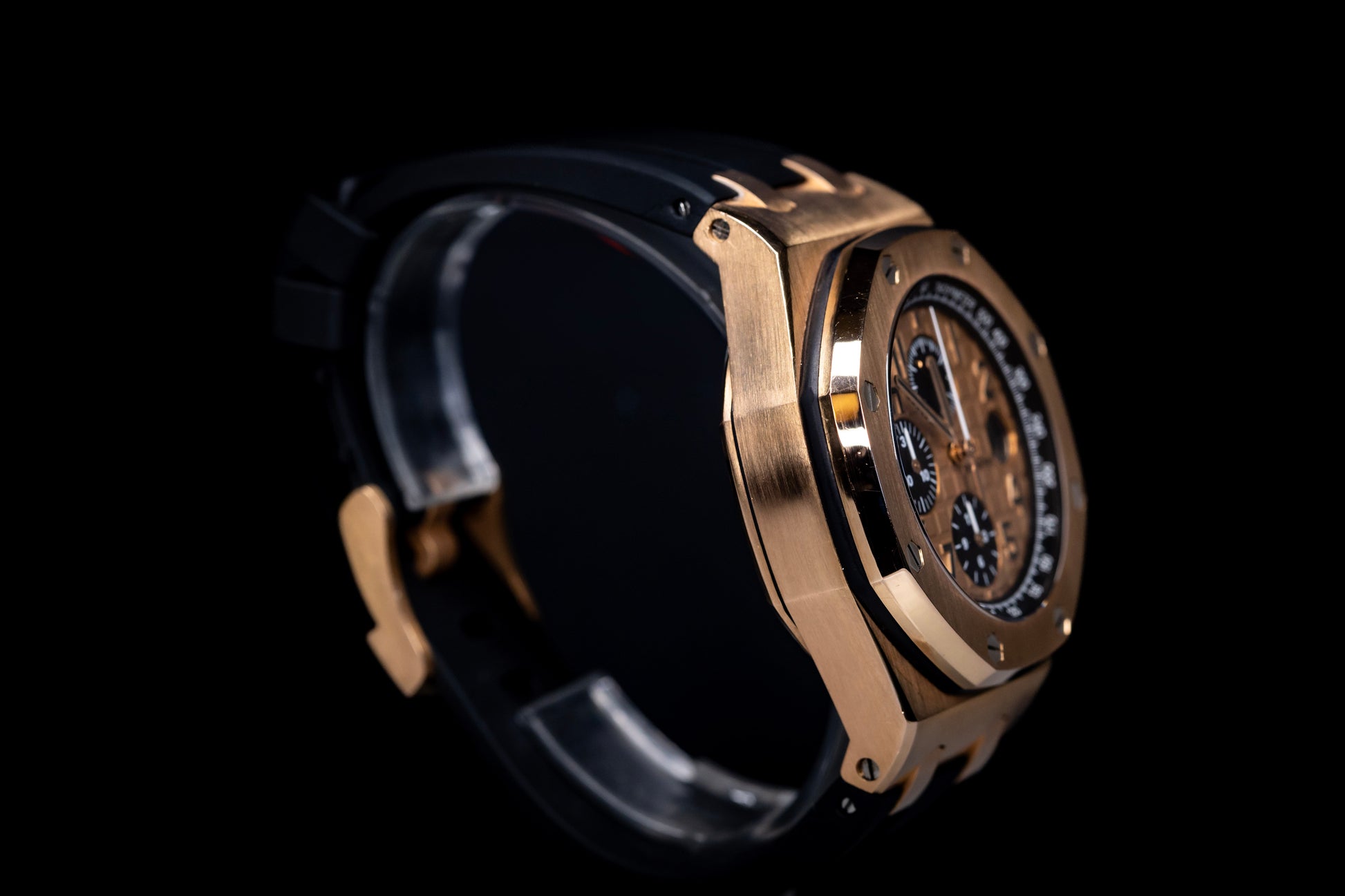 Audemars Piguet Royal Oak Offshore Chronograph 42mm in rose gold with black rubber strap and chronograph features.