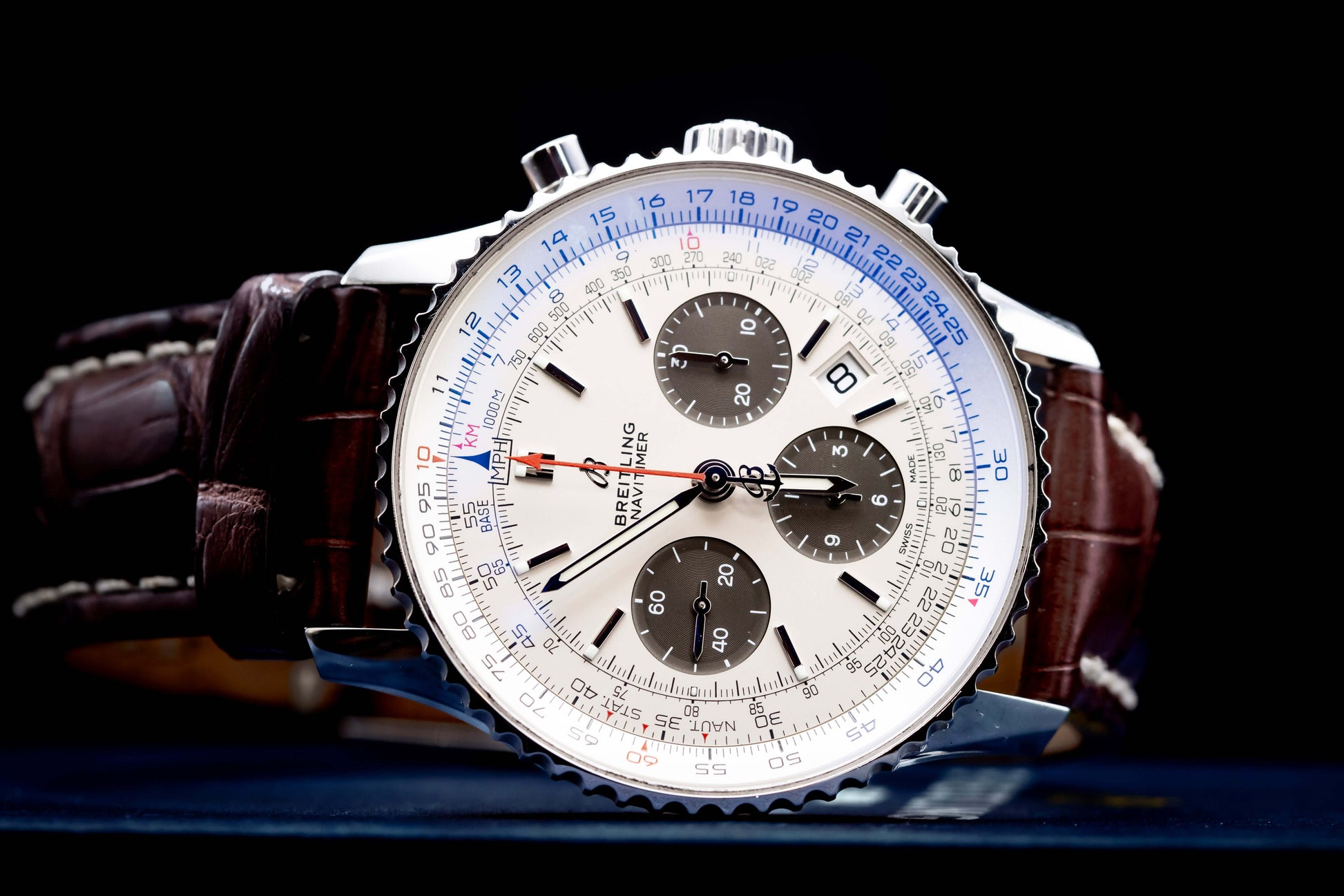 Breitling Navitimer 1 B01 Chronograph 43mm  Ref:AB0121211G1P1 watch with silver dial and brown leather strap.