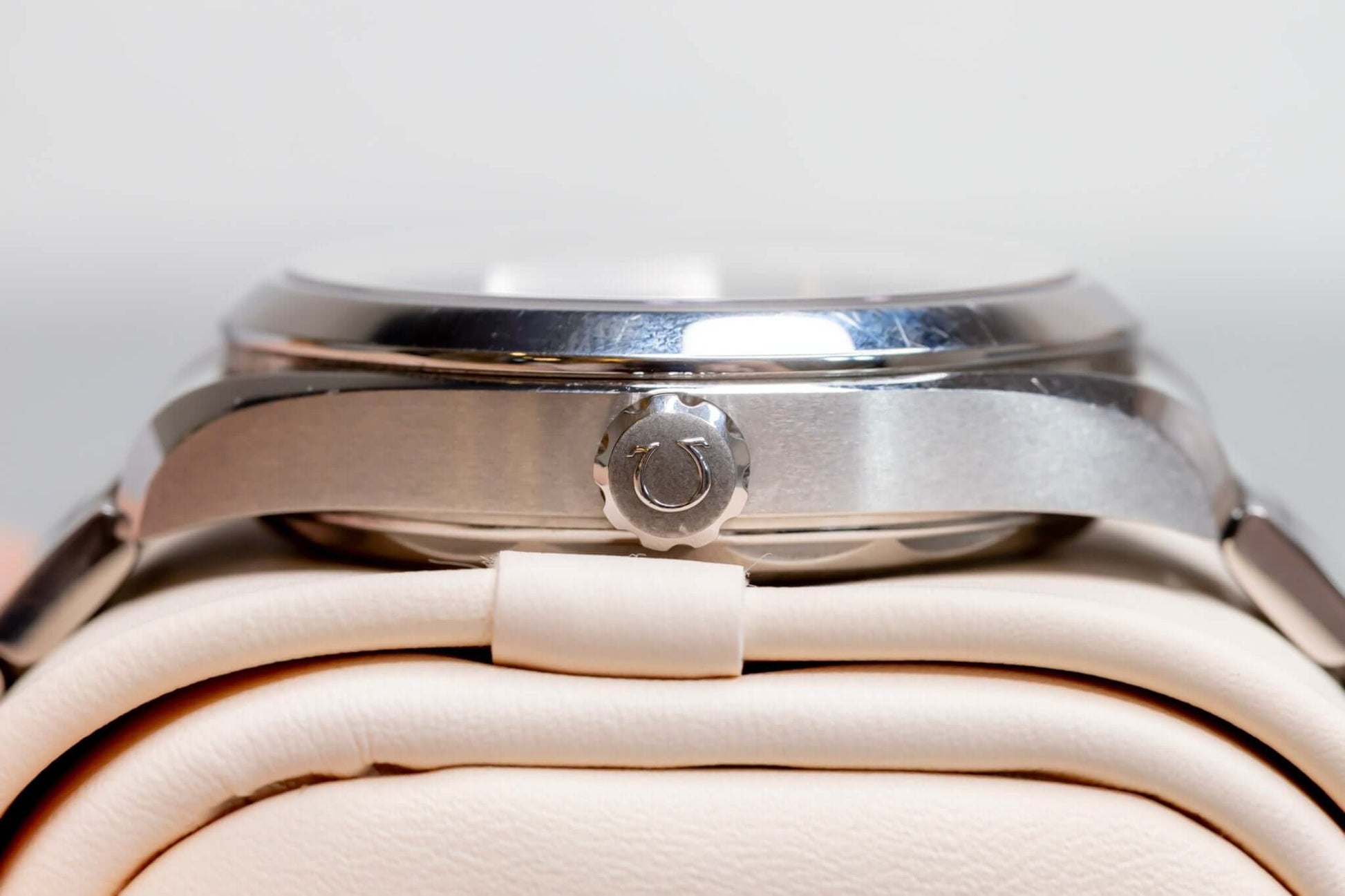 Close-up view of Omega Aqua Terra Small Seconds watch case showcasing the crown and polished stainless steel finish.