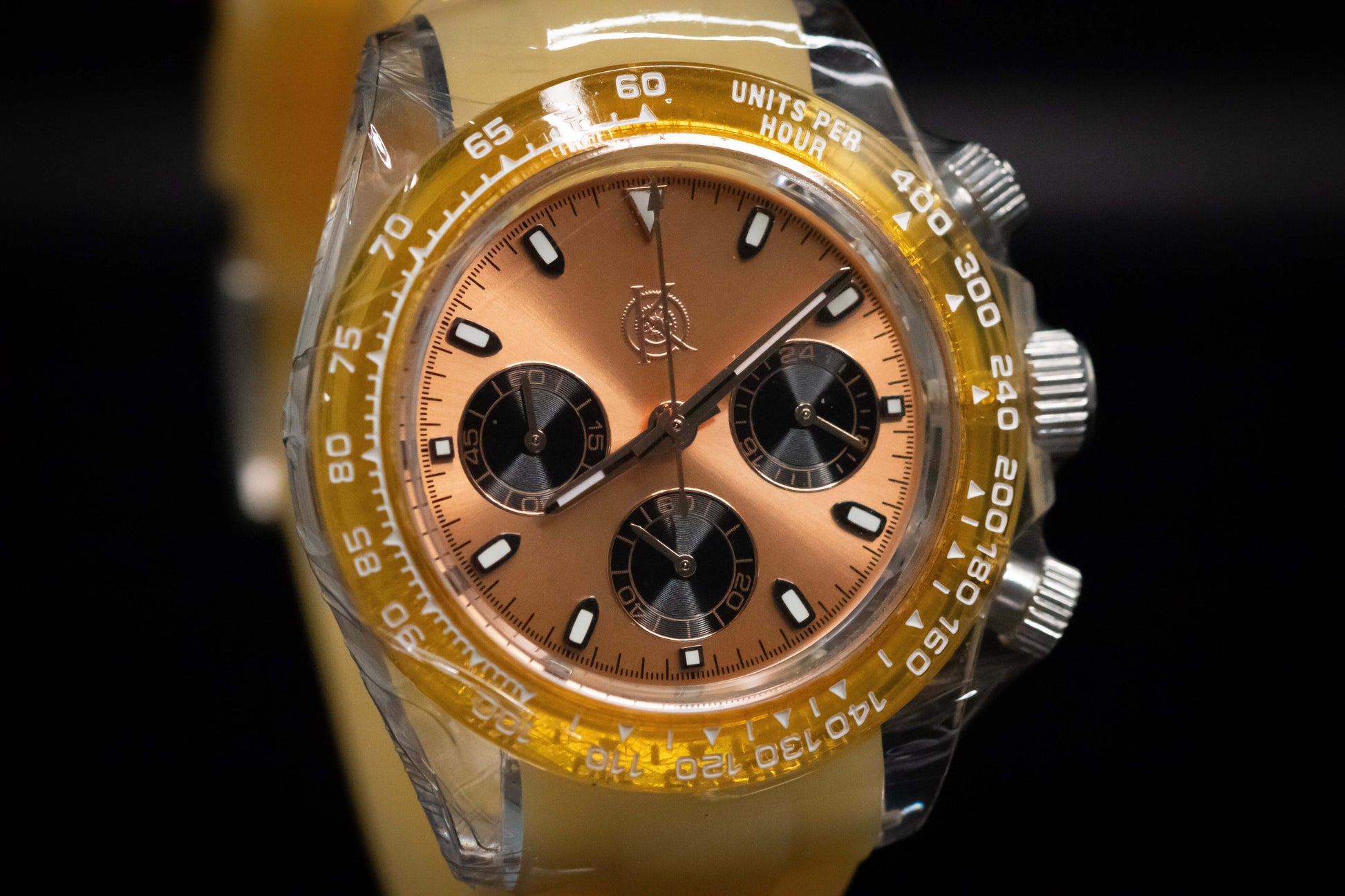 KWC Orange Ceramic Chronograph with brushed gold dial and ceramic bezel, showcasing modern design and utility.