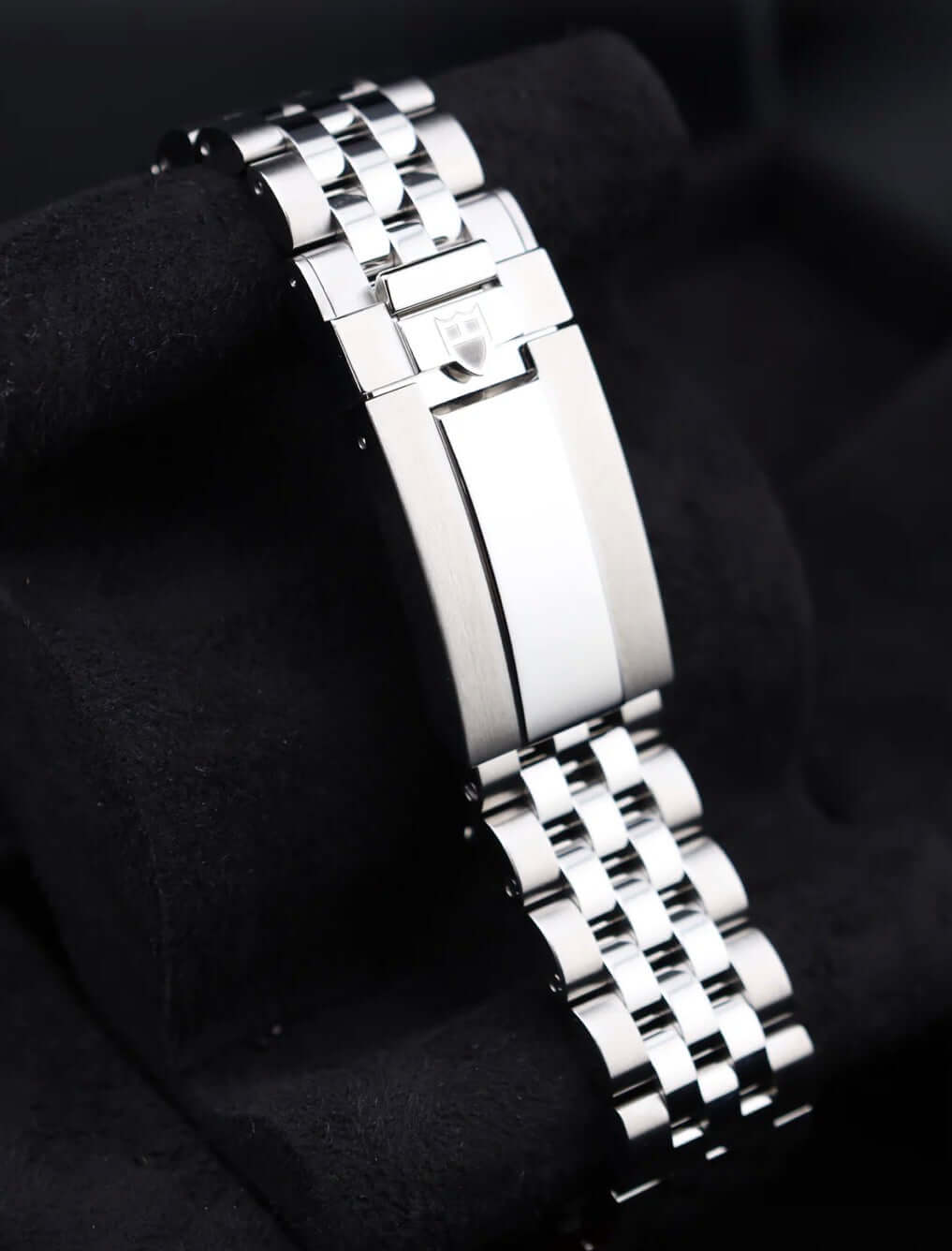 Tudor Black Bay Chrono Pink 79360N watch bracelet showcasing its sleek design and polished finish.