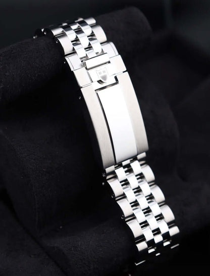 Tudor Black Bay Chrono Pink 79360N watch bracelet showcasing its sleek design and polished finish.