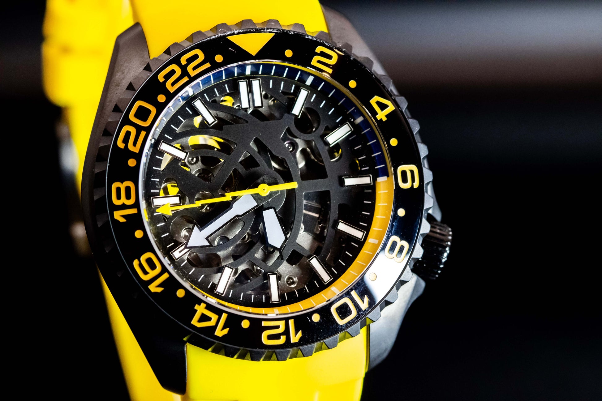 Yellow Skeleton SKX watch with a black stainless steel case and vibrant yellow accents.
