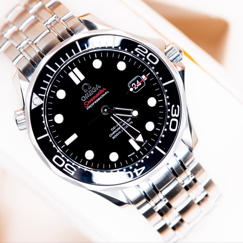 2018 Omega Seamaster Diver watch with black dial and stainless steel bracelet in original box.