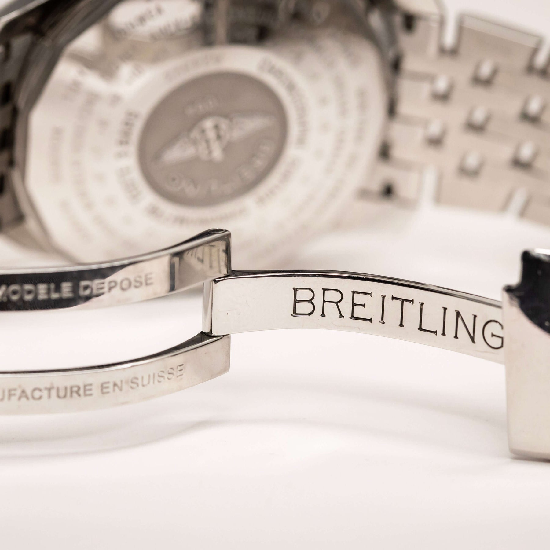 Breitling Navitimer World Chronograph detailed view of stainless-steel bracelet clasp with engraved logo.