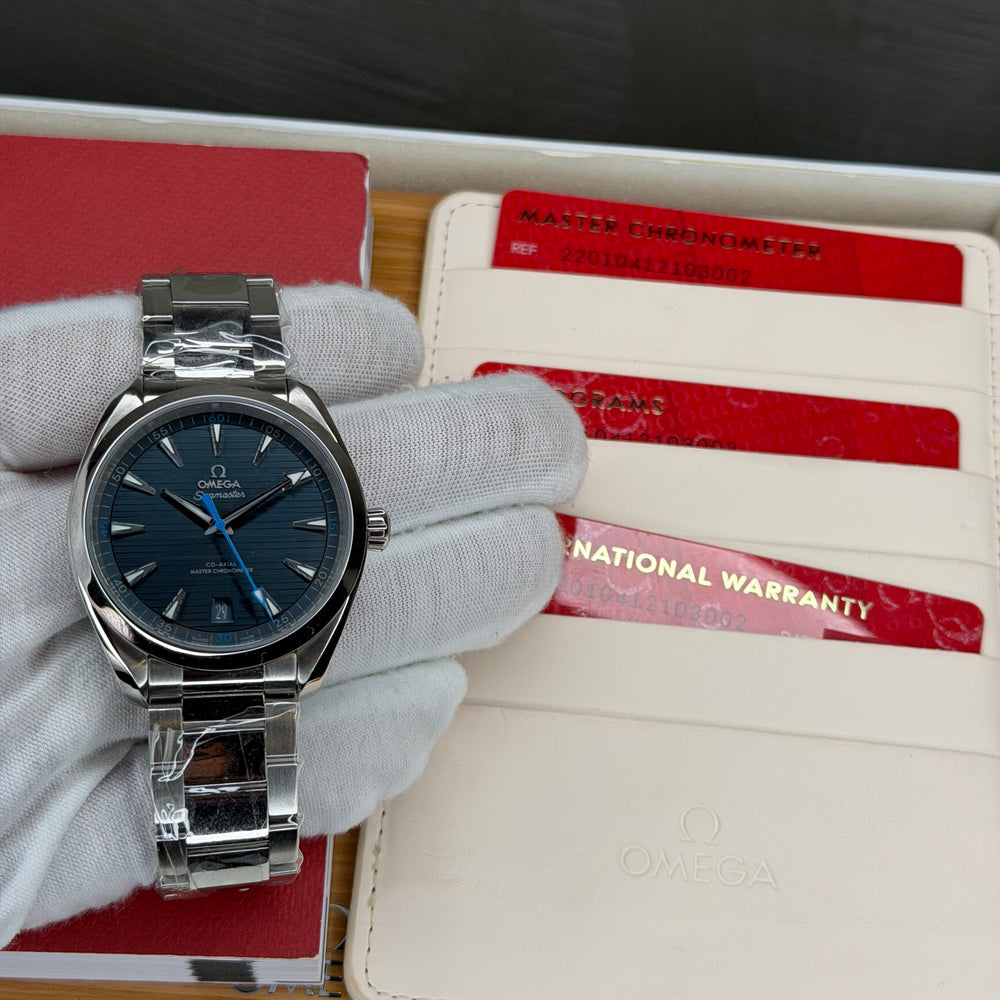 2023 Omega Seamaster Aqua Terra 41mm blue dial watch with warranty cards in display box.