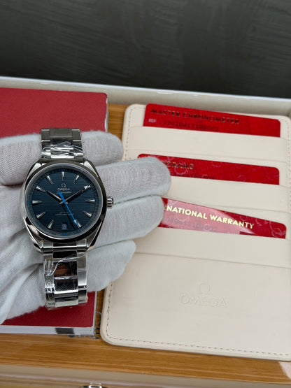 2023 Omega Seamaster Aqua Terra 41mm blue dial watch with warranty cards in display box.