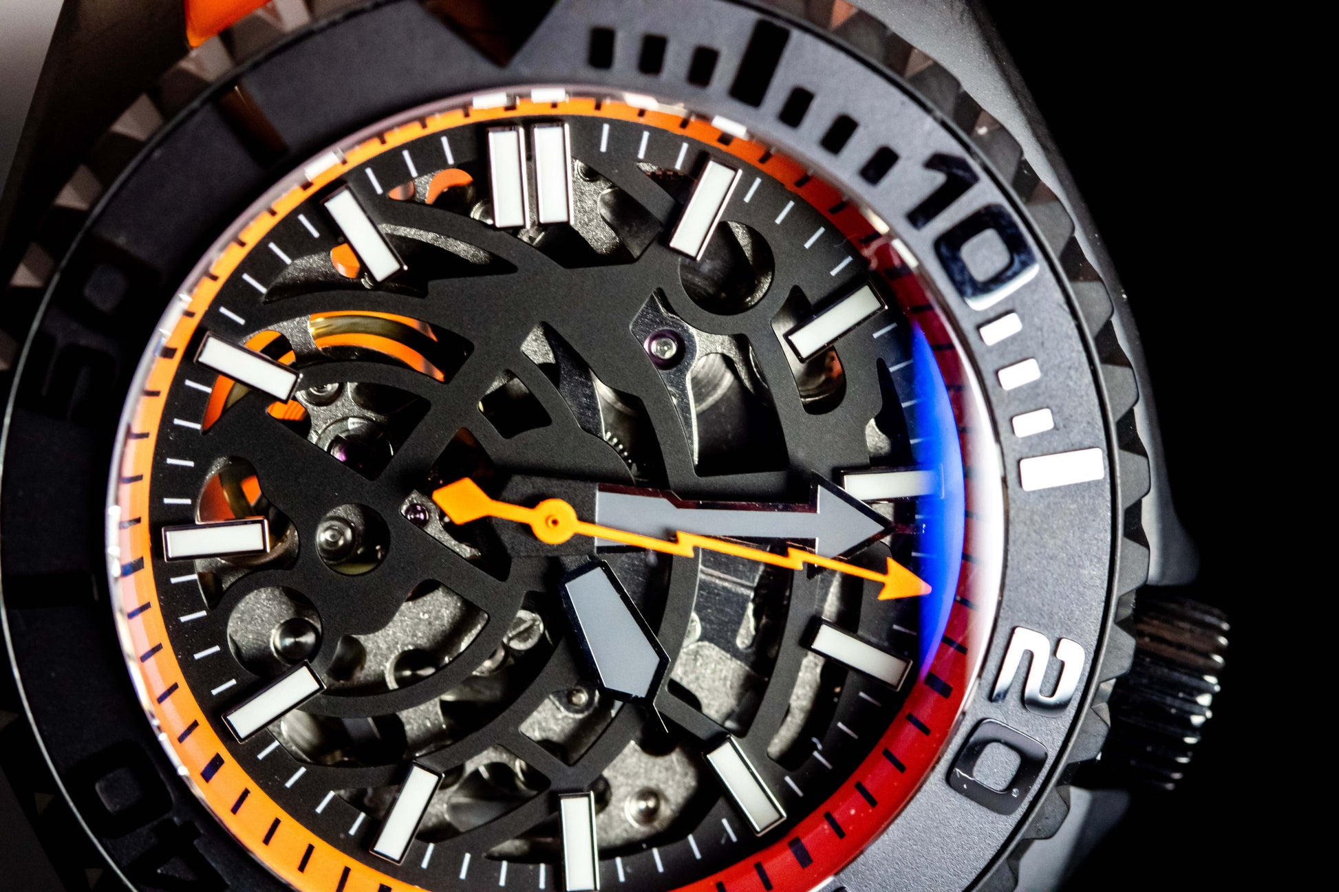 Seikomod Orange Skeleton SKX watch close-up, showcasing its bold skeleton dial and vibrant accents.