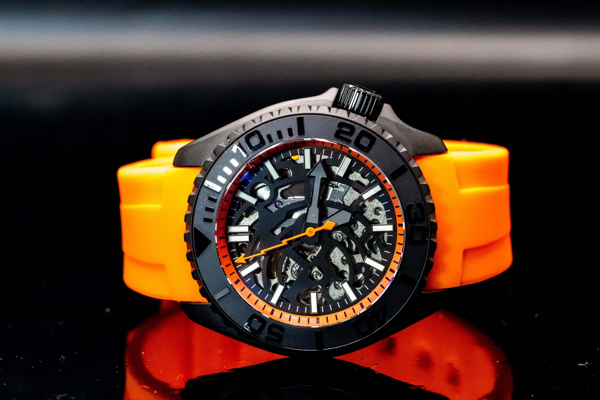Seikomod Orange Skeleton SKX watch showcasing skeleton dial and vibrant orange accents on a black strap.