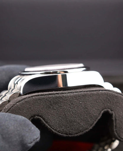 Tudor Black Bay Chrono Pink 79360N showing side view on a cushion display with dark background.