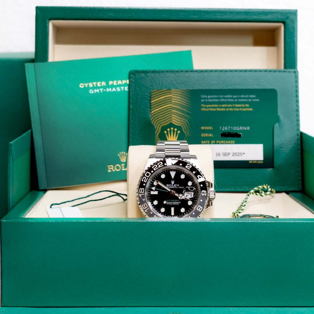 2025 Rolex GMT-Master II Bruce Wayne in packaging with booklets and warranty card.