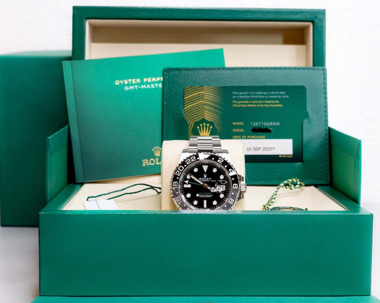 2025 Rolex GMT-Master II Bruce Wayne in packaging with booklets and warranty card.