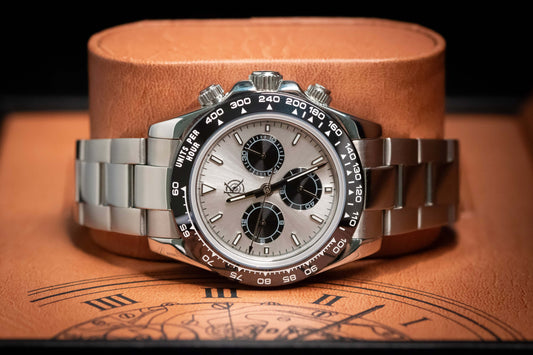 Kingdom 7750 Automatic Chronograph watch with silver dial and stainless steel bracelet, showcasing precision and reliability.