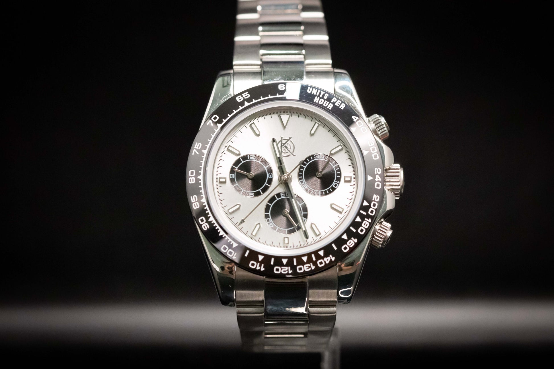 Kingdom 7750 Automatic Chronograph watch with a silver dial and stainless steel bracelet, showcasing precision and style.