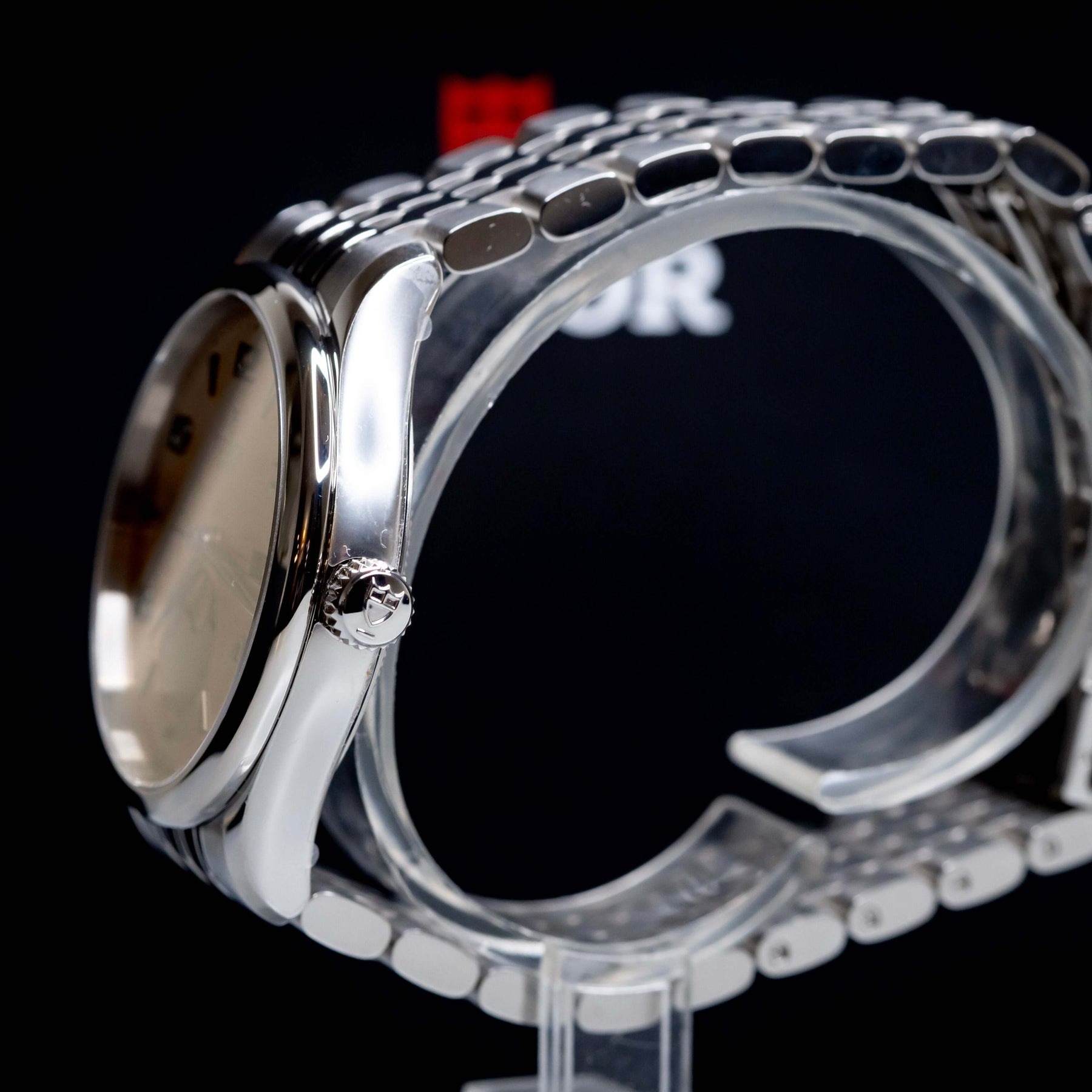 Tudor 1926 Luna 39mm Champagne Dial side view showcasing the stainless steel case and bracelet.