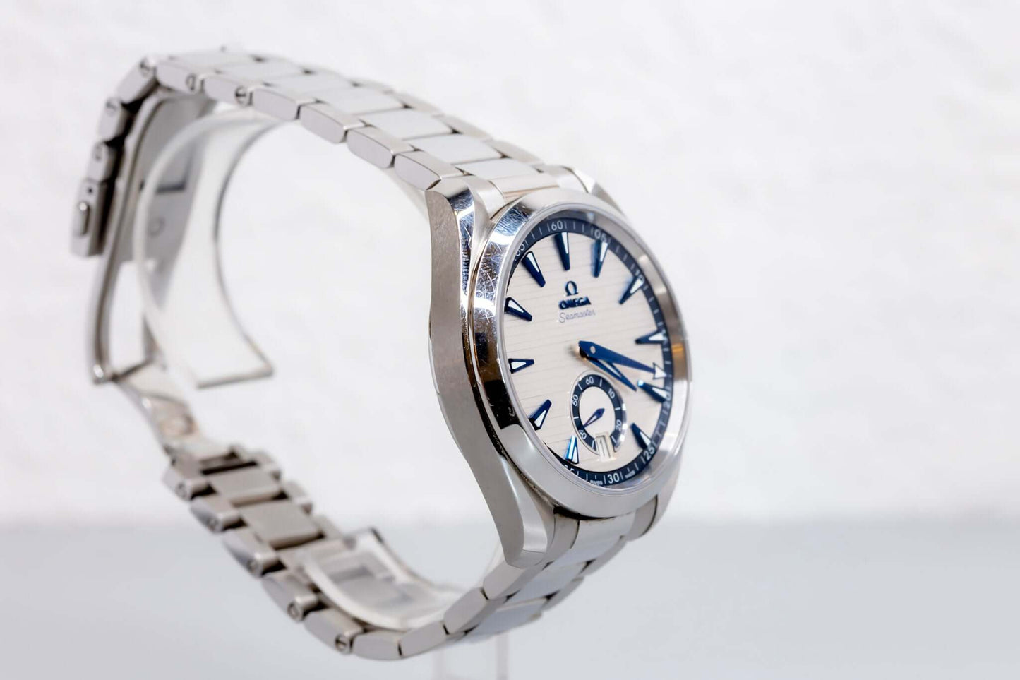 Omega Aqua Terra Small Seconds watch showcasing silver teak-pattern dial and stainless steel bracelet.