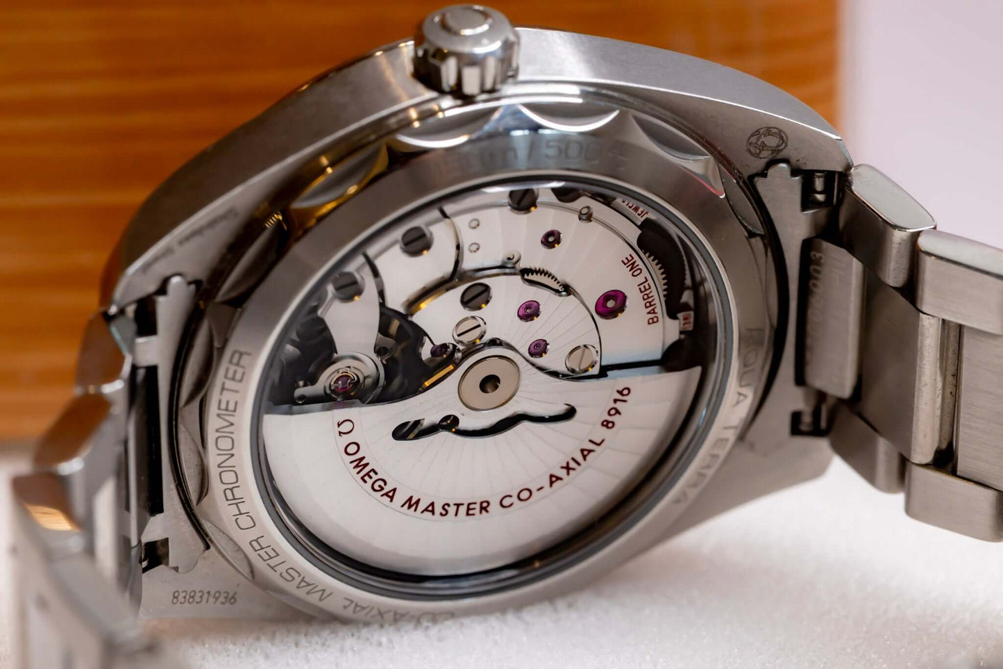 Omega Aqua Terra Small Seconds watch with transparent case back showcasing Co-Axial movement details.