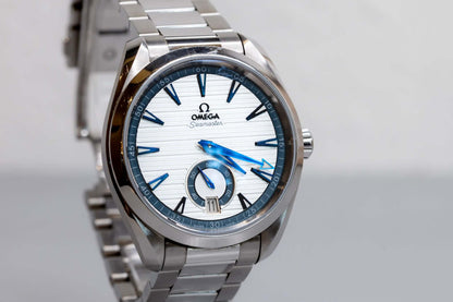 Omega Aqua Terra Small Seconds watch with silver teak-pattern dial and stainless steel bracelet.