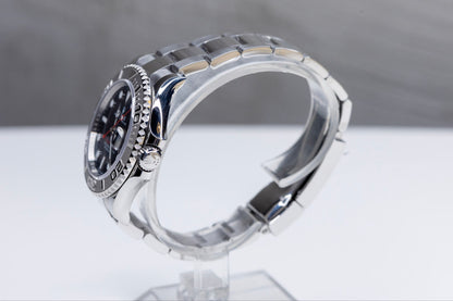 2024 Rolex Yachtmaster Superman side view showcasing the elegant design and Platinum bezel on a clear display stand.