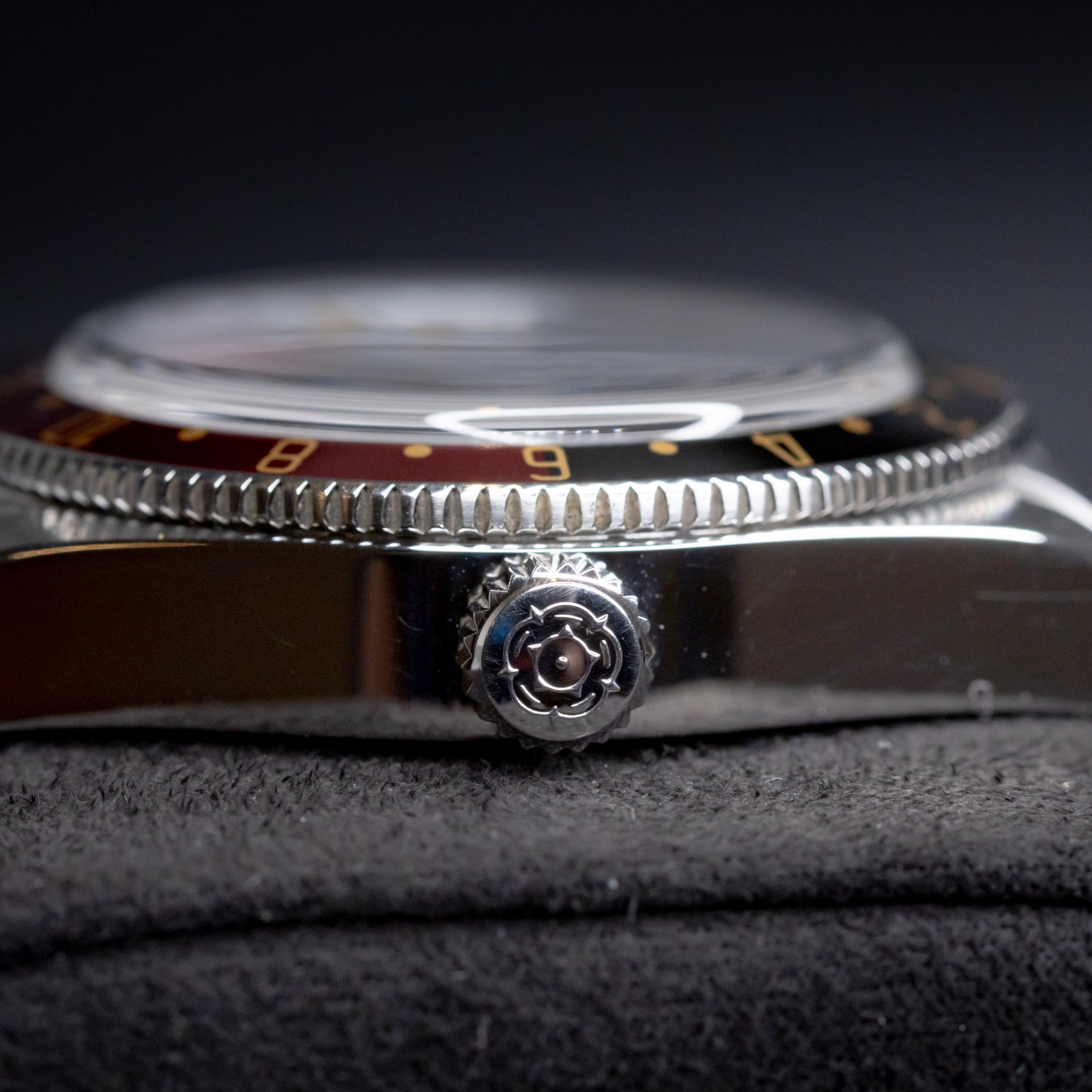Tudor Black Bay 58 GMT Coke watch side view showcasing the crown and bezel.