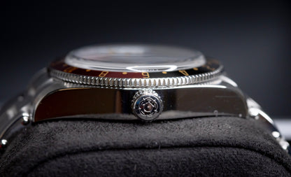 Tudor Black Bay 58 GMT Coke watch side view showcasing the crown and bezel.