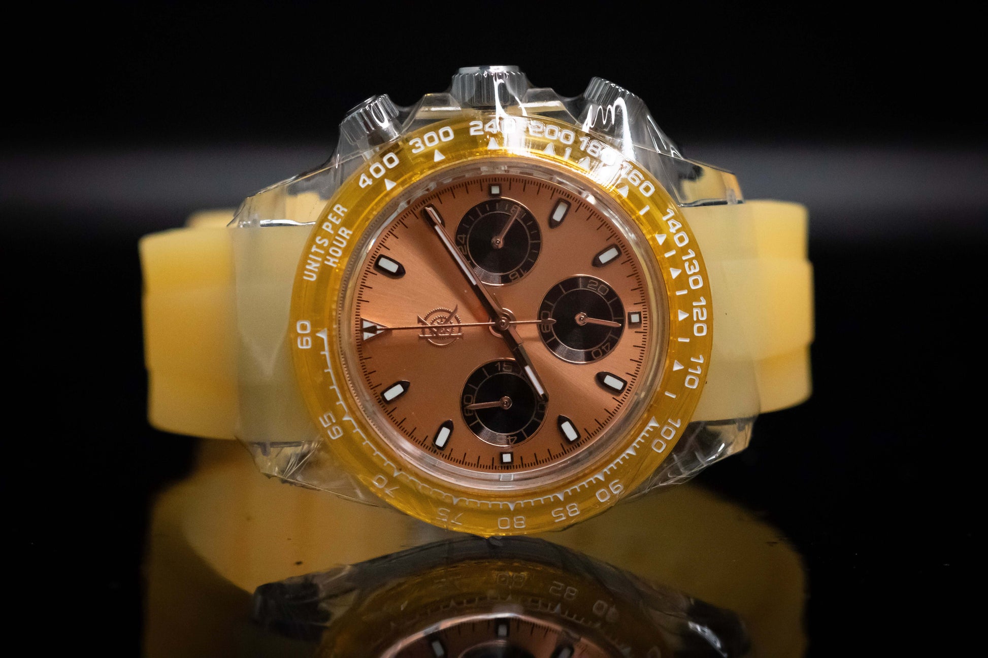 KWC Orange Ceramic Chronograph with gold dial and yellow silicone strap displaying modern design and chronograph functions.
