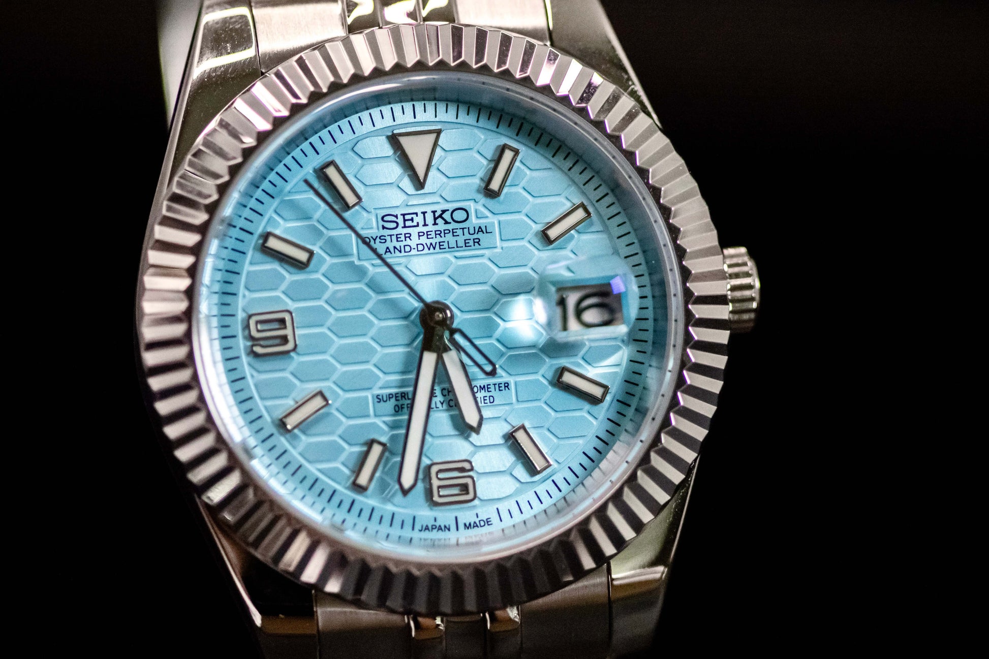 Ice Blue Seiko Mod Land Dweller watch with frosted metallic dial and bold design, featuring automatic movement.