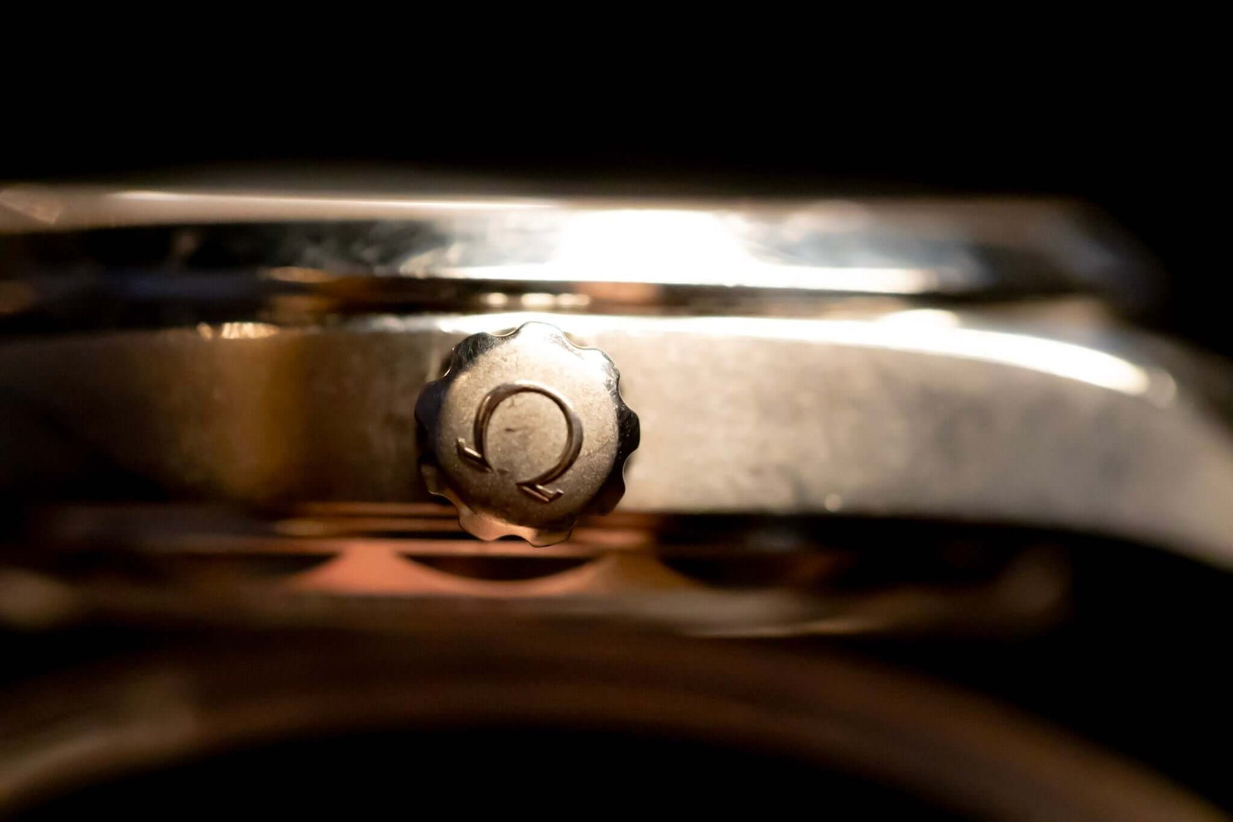 Close-up of the crown detail on the 2022 Omega Seamaster Aqua Terra watch, showcasing its luxury design.