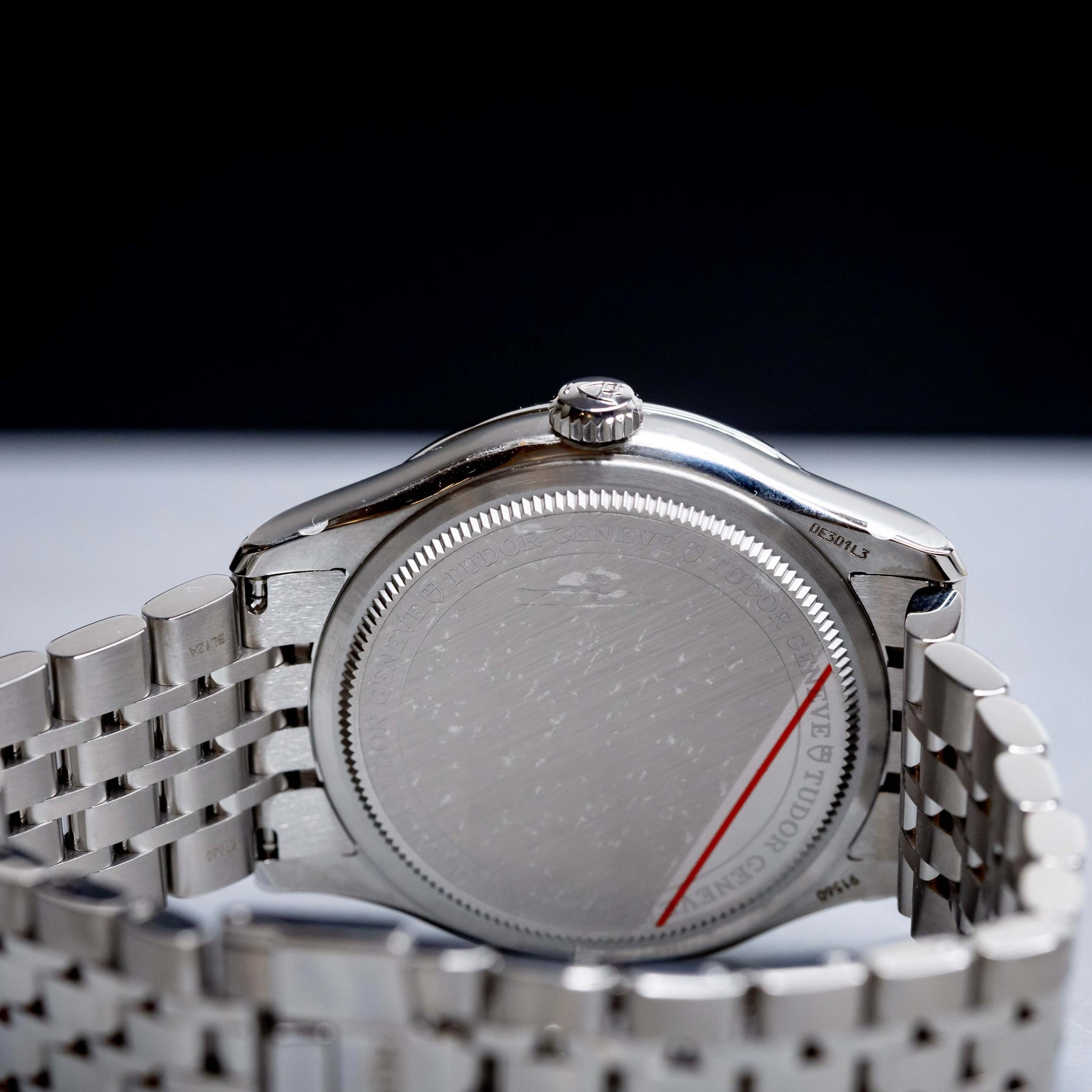 Tudor 1926 Luna 39mm Champagne Dial watch case back with stainless steel bracelet.