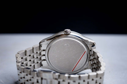 Tudor 1926 Luna 39mm Champagne Dial watch case back with stainless steel bracelet.