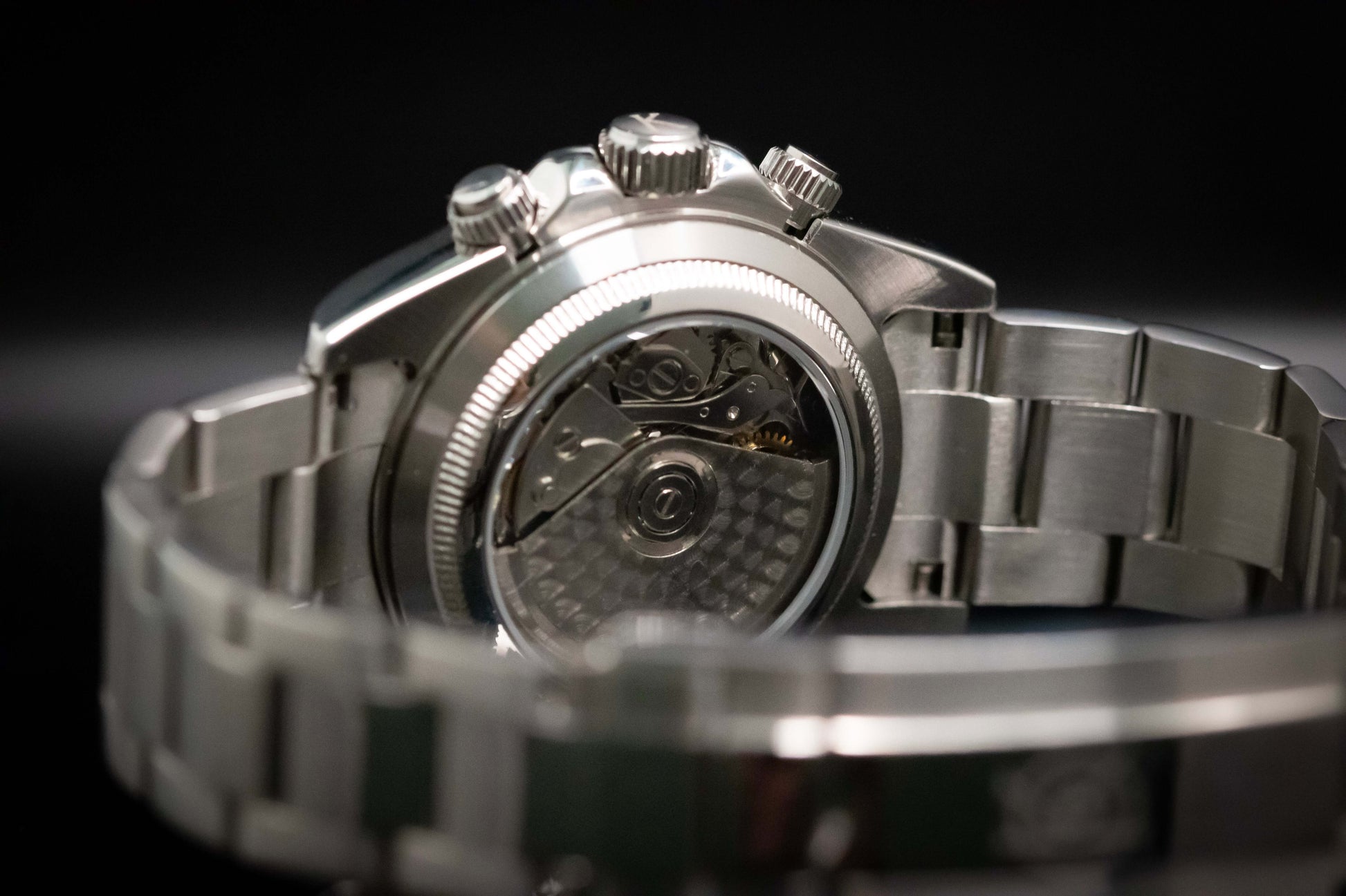 Back view of Kingdom 7750 Automatic Chronograph showcasing Swiss movement and stainless steel bracelet.